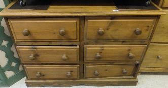 A modern pine bank of six drawers