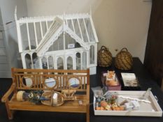 A miniature greenhouse with assorted pla