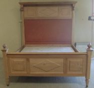 A modern beech and elm bedstead in the V