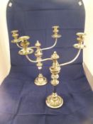 A pair of plated two branch candelabra w