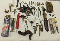 A box containing assorted corkscrews, bottle openers, knives, etc, to include a bone-handled hunting