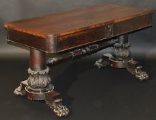 A 19th Century rosewood library table wi