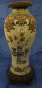 A 19th Century Chinese polychrome decorated baluster shaped vase with gilt brass applied neck and