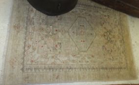 An Oriental rug with central diamond sha