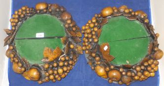 A pair of carved treen ware fruit decora