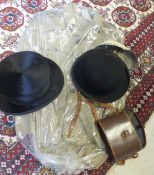 A black silk top hat, a black felt bowler hat, a Calcutta Light Horse khaki military style jacket,