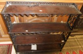 A Chippendale style mahogany four tier w