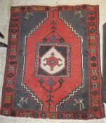A Caucasian rug, the central medallion i