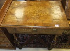 An 18th Century and later walnut and seaweed marquetry inlaid side table, the medallion decorated