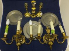 Three brass candlesticks, a pair of bras