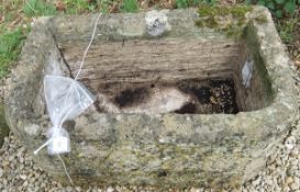 A natural stone D shaped trough