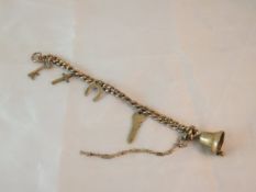 A 9 carat gold charm bracelet with various charms including bell and key CONDITION REPORTS Overall