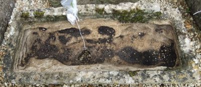 A natural stone rectangular trough