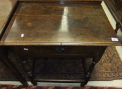 An oak single drawer side table in the 18th Century manner, raised on baluster turned supports to