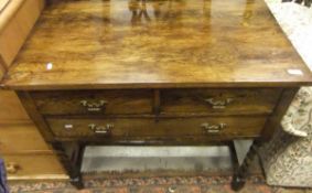 An early 20th Century oak side table wit