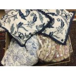 A box containing two quilted bedspreads,
