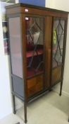 An Edwardian mahogany and inlaid display