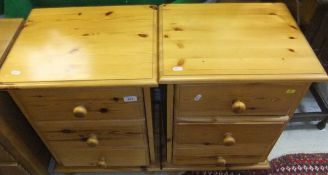 A pair of modern pine bedside tables wit