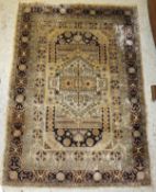A Persian silk rug, the centre medallion