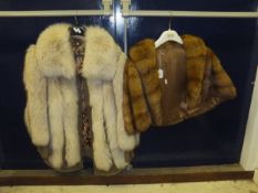 A fur jacket, the satin lining inscribed