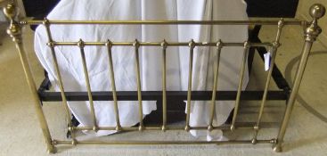 A modern brass bedstead in the Victorian