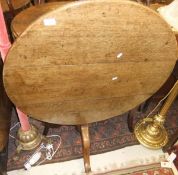 An early 19th Century oak tea table, the