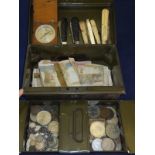 A tin money box containing various Briti