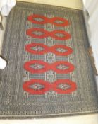 An Afghan rug, the terracotta centre fie
