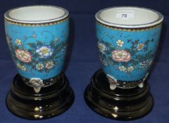 A pair of Chinese porcelain jardiniers with "cloisonne" style decoration, together with two black