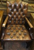 A modern buttoned leather upholstered office armchair CONDITION REPORTS Various wear and scuffs.