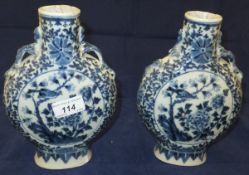 A pair of late 19th / early 20th Century Chinese porcelain moon flasks decorated in underglaze