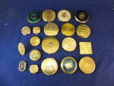 A box containing assorted compacts to in