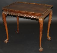 An Edwardian mahogany silver table in the George III taste, the pie crust dished top over a