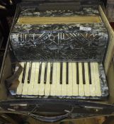 An Alvari twelve button two octave piano