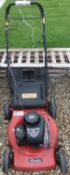 A Sovereign petrol lawn mower with Brigg