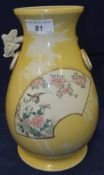 An Oriental porcelain baluster shaped vase with ring handles, decorated with bird amongst