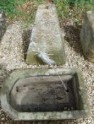 A natural stone D end trough and staddle