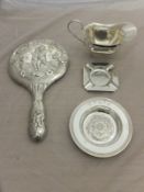 An Edwardian embossed silver dressing ta