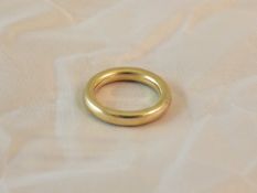 An 18ct gold ring CONDITION REPORTS Has some general wear and scuffs.  The ring is rounded