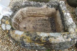 A natural stone D shaped trough