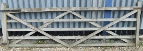 A large wooden farm gate CONDITION REPORTS Gate overall with weathering and chips and various
