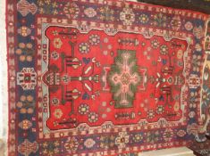 A Caucasian rug, the central salmon and