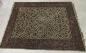 A Tabriz carpet, the cream centre field with all over repeating stylised foliate decoration in