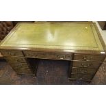 A mahogany pedestal desk of nine drawers