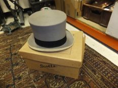 A grey top hat by Scott & Co, housed in