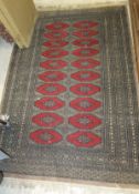 An Afghan rug, the two rows of ten repea