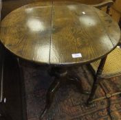 A 19th Century oak tea table, the circul