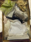 A box containing various textiles to inc