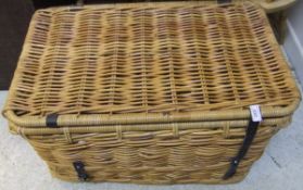 A rectangular wicker laundry basket cont