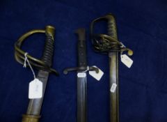 A British Cavalry sword, un-marked, one further cavalry officer's sword and a bayonet CONDITION